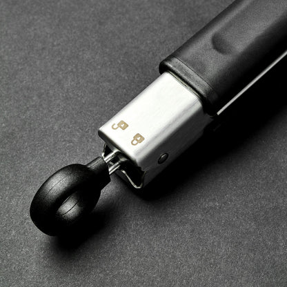 A closeup of the end of HexClad tongs.